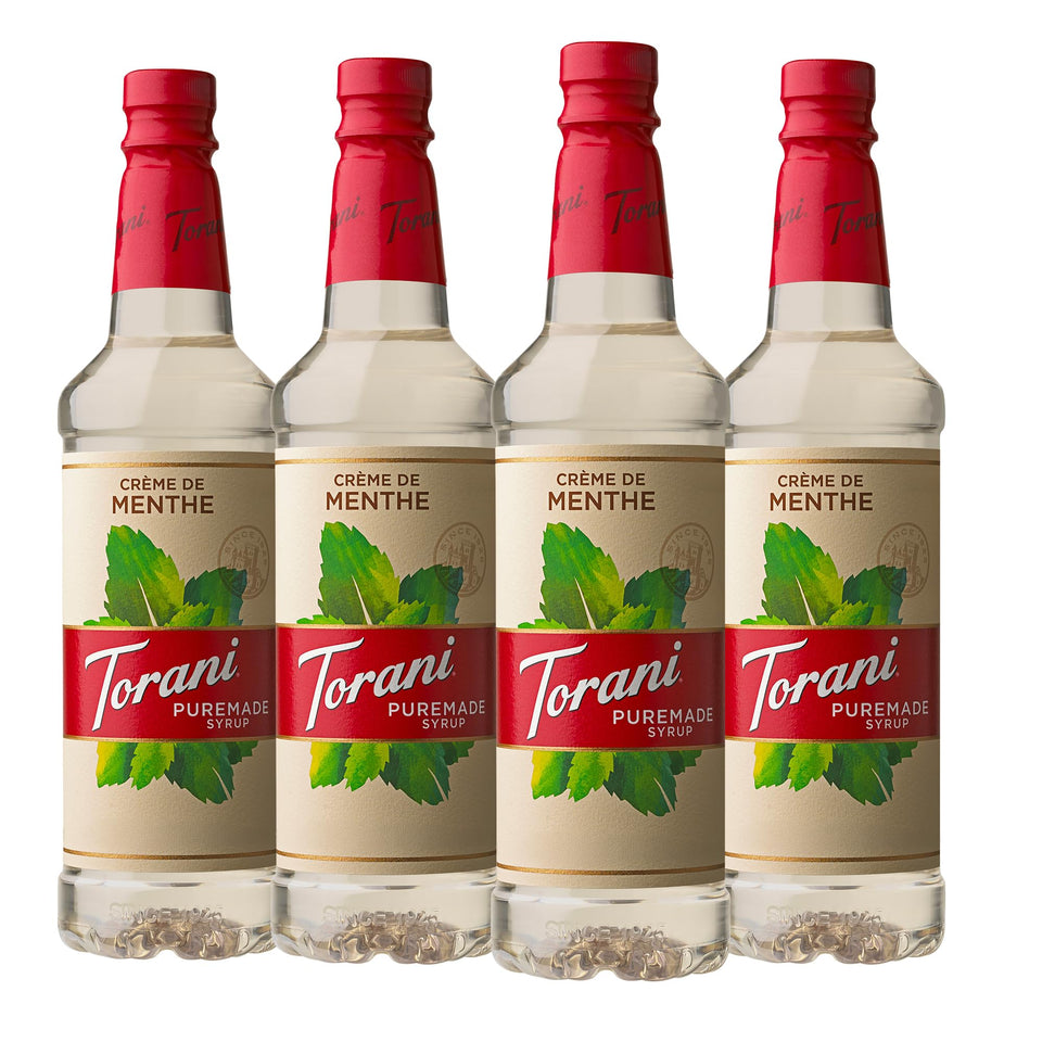 Torani Puremade Creme De Menthe syrup bottle pouring for minty beverages.