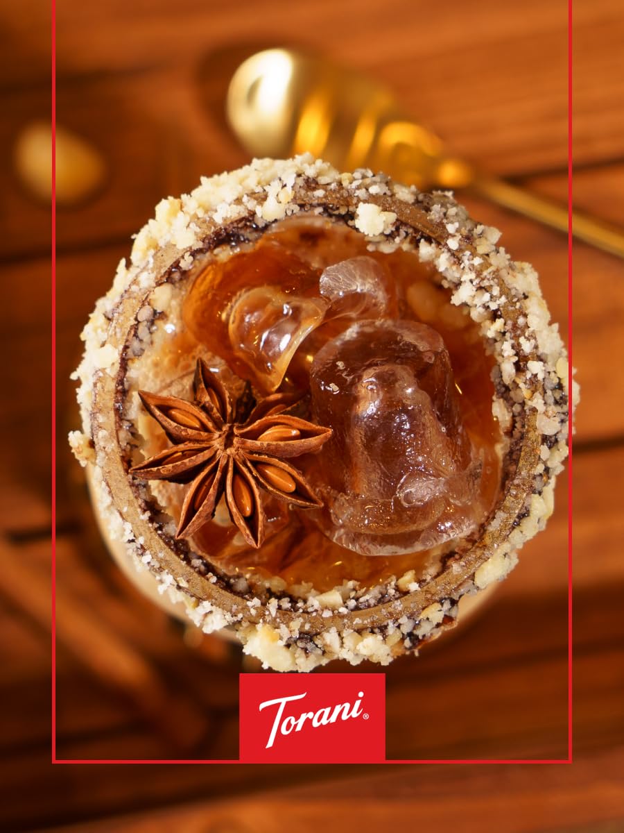 Glass bottle of Torani Puremade Hazelnut Syrup on shelf
