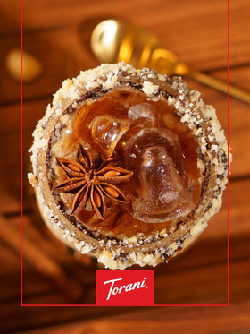 Glass bottle of Torani Puremade Hazelnut Syrup on shelf
