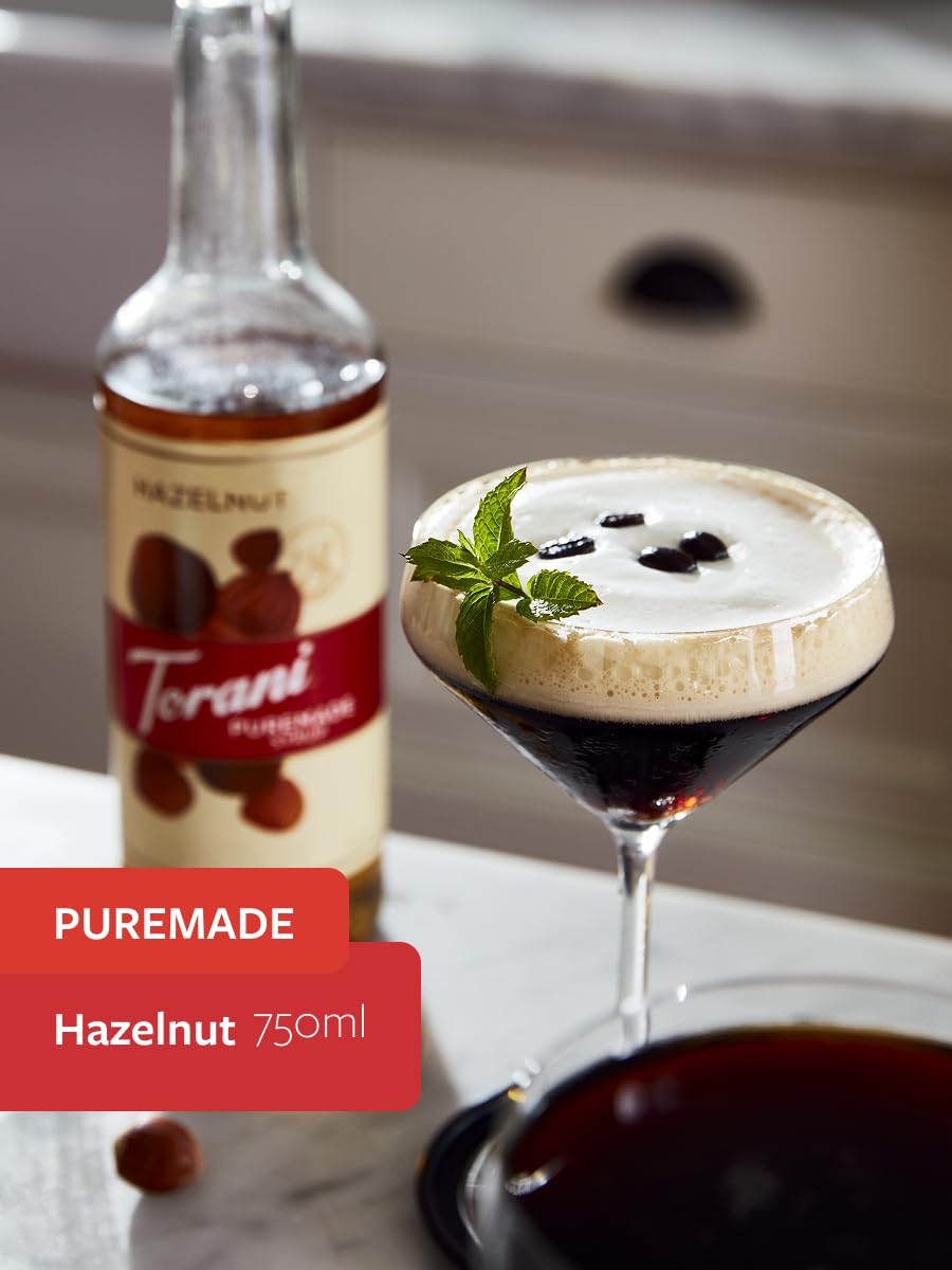 Torani Puremade Hazelnut Syrup being poured into a mug for latte