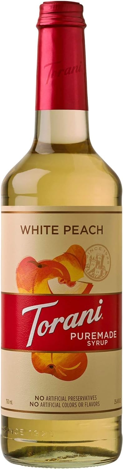 Torani Puremade White Peach syrup bottle showcasing natural flavors for drinks.