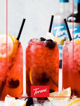 Torani Sugar Free Black Cherry Syrup label close-up with almond notes.