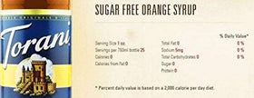 Torani sugar-free orange syrup with a dessert pairing on a plate