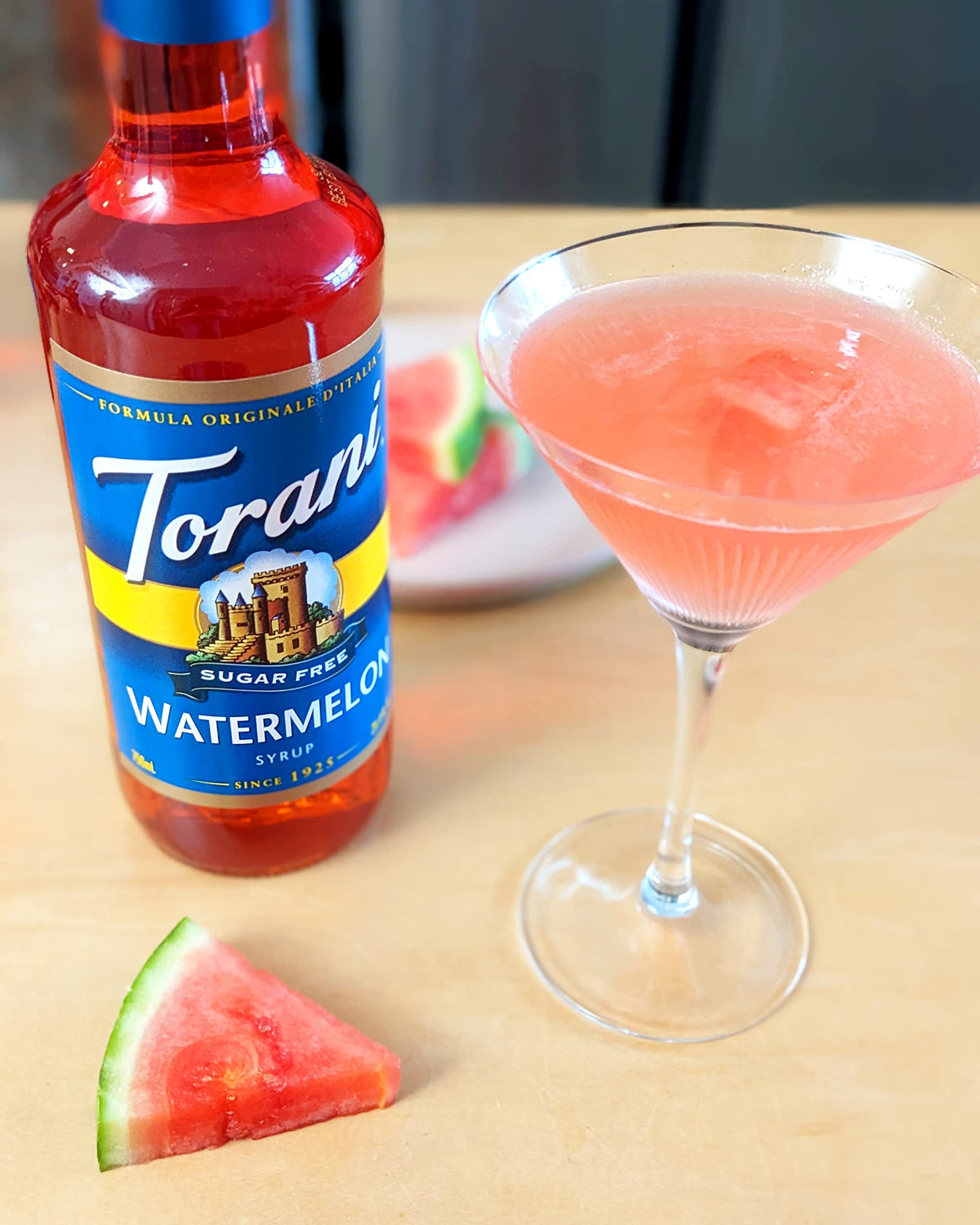 Torani Sugar Free Watermelon Syrup pours into a glass for refreshing drinks.