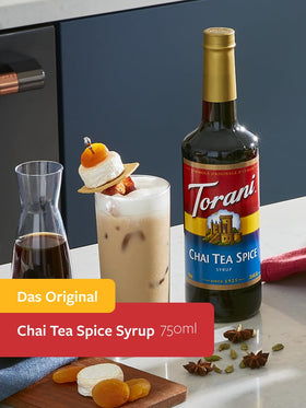 Pouring Torani Chai Tea Spice syrup to flavor a drink