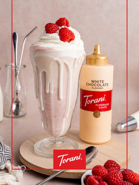 Torani White Chocolate Sauce poured into a coffee cup