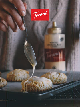 Torani White Chocolate Sauce over latte art highlighting creamy flavor