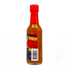 Torchbearer Honey Badger Hot Sauce wings plated with glaze