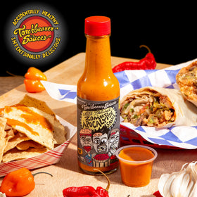 Torchbearer Zombie Apocalypse ghost chili sauce pour shows dramatic heat for wings.