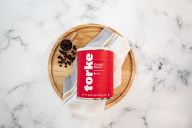 Torke Coffee ground 26 oz can on shelf highlights recyclable packaging for easy storage.