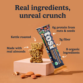Tosi Almond Nut Bars ingredients close-up showing almonds, chia, flax, and sesame.
