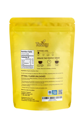 TOZZY Dandelion Tea pyramid bag steeping for a soothing cup.