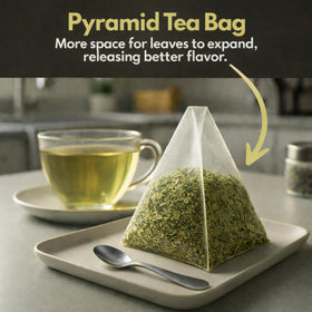 Cup of TOZZY Organic Green Tea showing clear, vibrant brew.