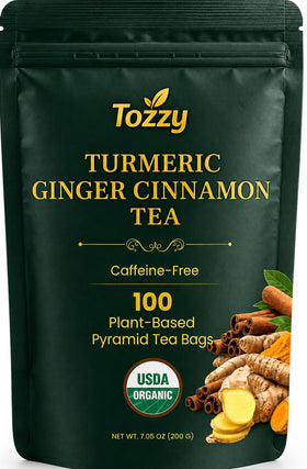 TOZZY organic turmeric ginger cinnamon tea pyramid bags ready for steeping with pure flavor.