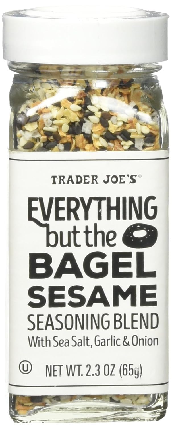 Trader Joe's Everything but the Bagel Sesame Seasoning shaker dispensing flavor on eggs.