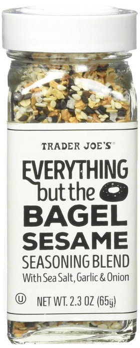 Trader Joe's Everything but the Bagel Sesame Seasoning shaker dispensing flavor on eggs.