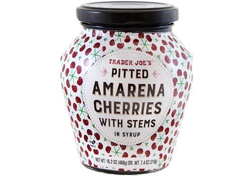Trader Joe's Pitted Amarena Cherries in a glass bowl, ideal for desserts and toppings.
