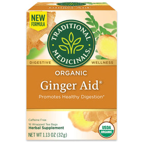 Traditional Medicinals Ginger Aid Tea bags steeping to soothe mild stomach discomfort.