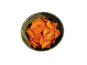 TRANADACO Red Hot Riplets ridged chips show spice and crunch.
