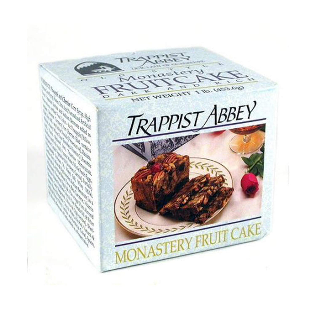 Sliced Trappist Abbey fruitcake on a serving board, perfect for sharing.