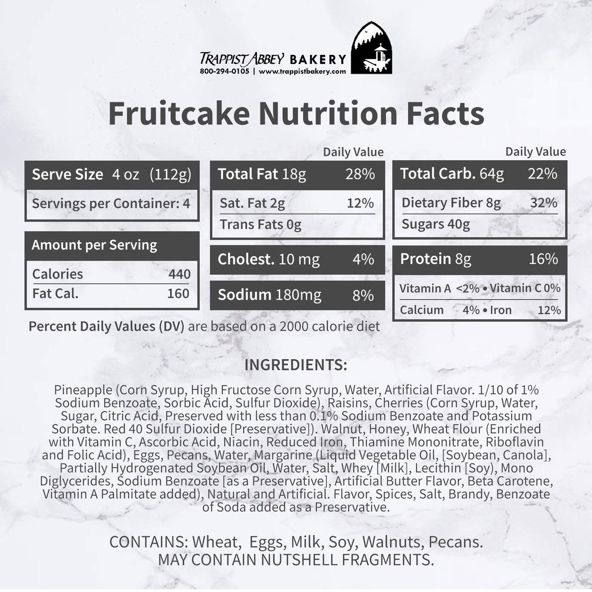 Whole Trappist Abbey fruitcake in branded tin, ideal for gifting or centerpiece.