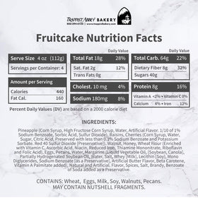 Whole Trappist Abbey fruitcake in branded tin, ideal for gifting or centerpiece.