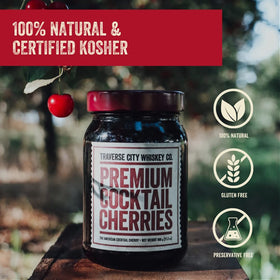 Traverse City Whiskey Co. deep-plum-red cherries with glossy syrup enhance cocktails.