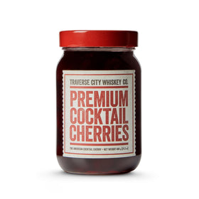 Traverse City Whiskey Co. premium cherries in a copper pot for rich, slow-cooked flavor.