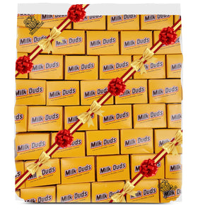 TREATBASKET Milk Dudes box close-up showing chewy caramel center for movie nights