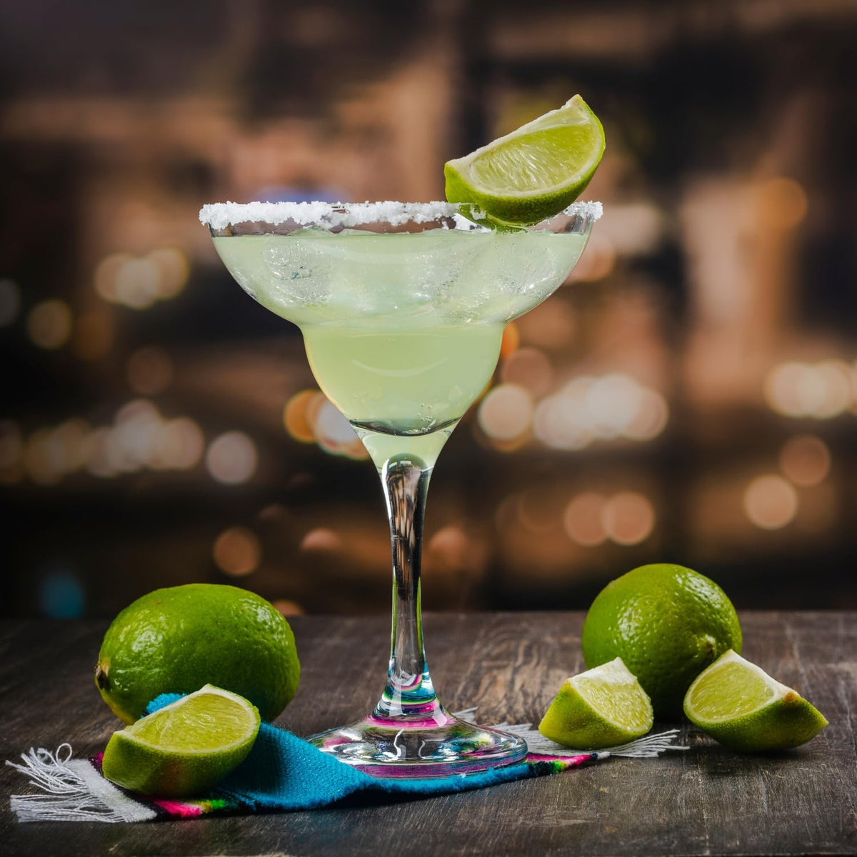 Margarita setup with ice, glass, and Tres Agaves mixer.