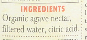 A spoon with Tres Agaves nectar showing controlled, low-calorie sweetening.