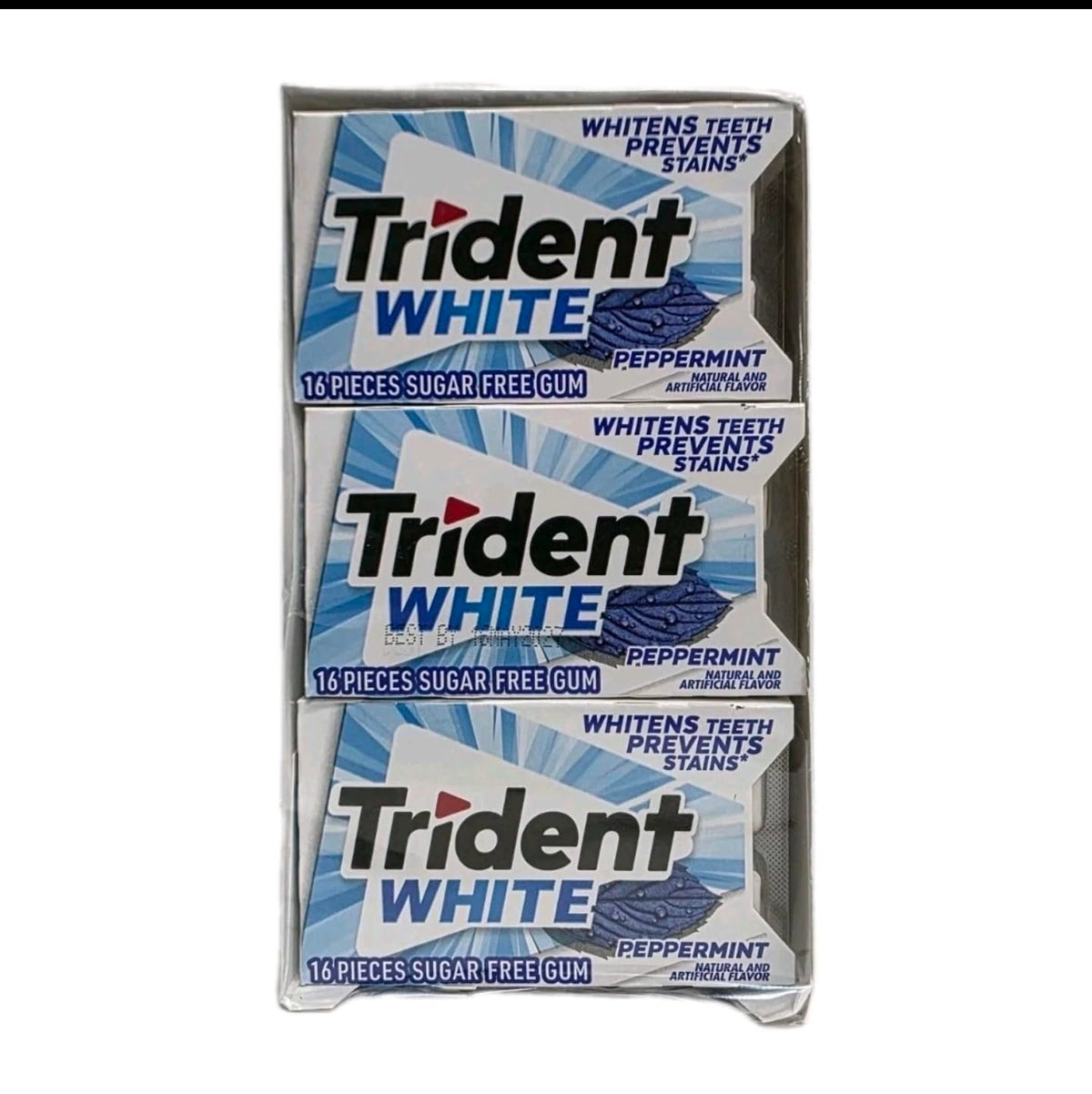 Trident White Peppermint gum pieces close-up highlighting sugar-free and minty texture.