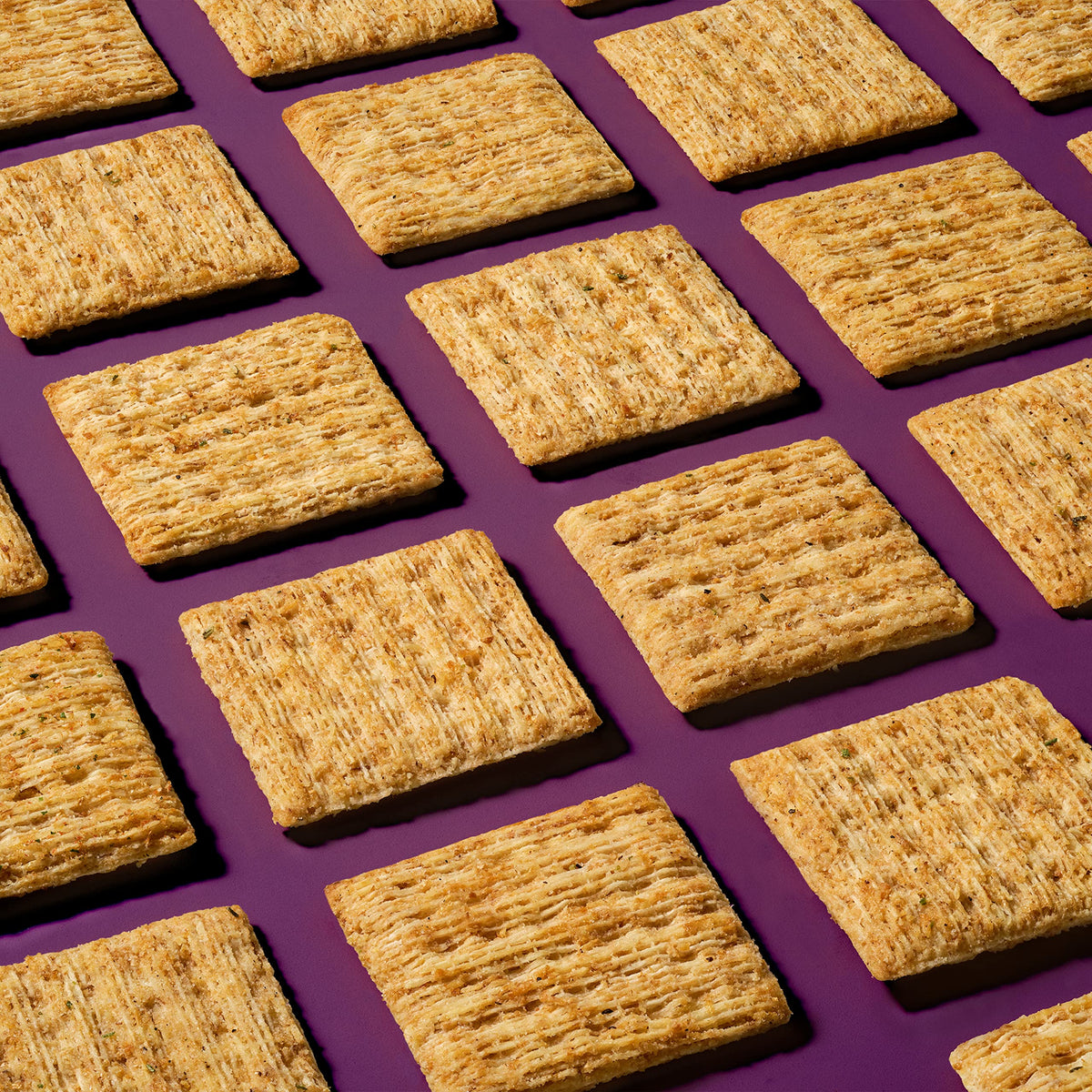 Triscuit Balsamic Vinegar & Basil cracker texture closeup, perfect for topping with cheese.