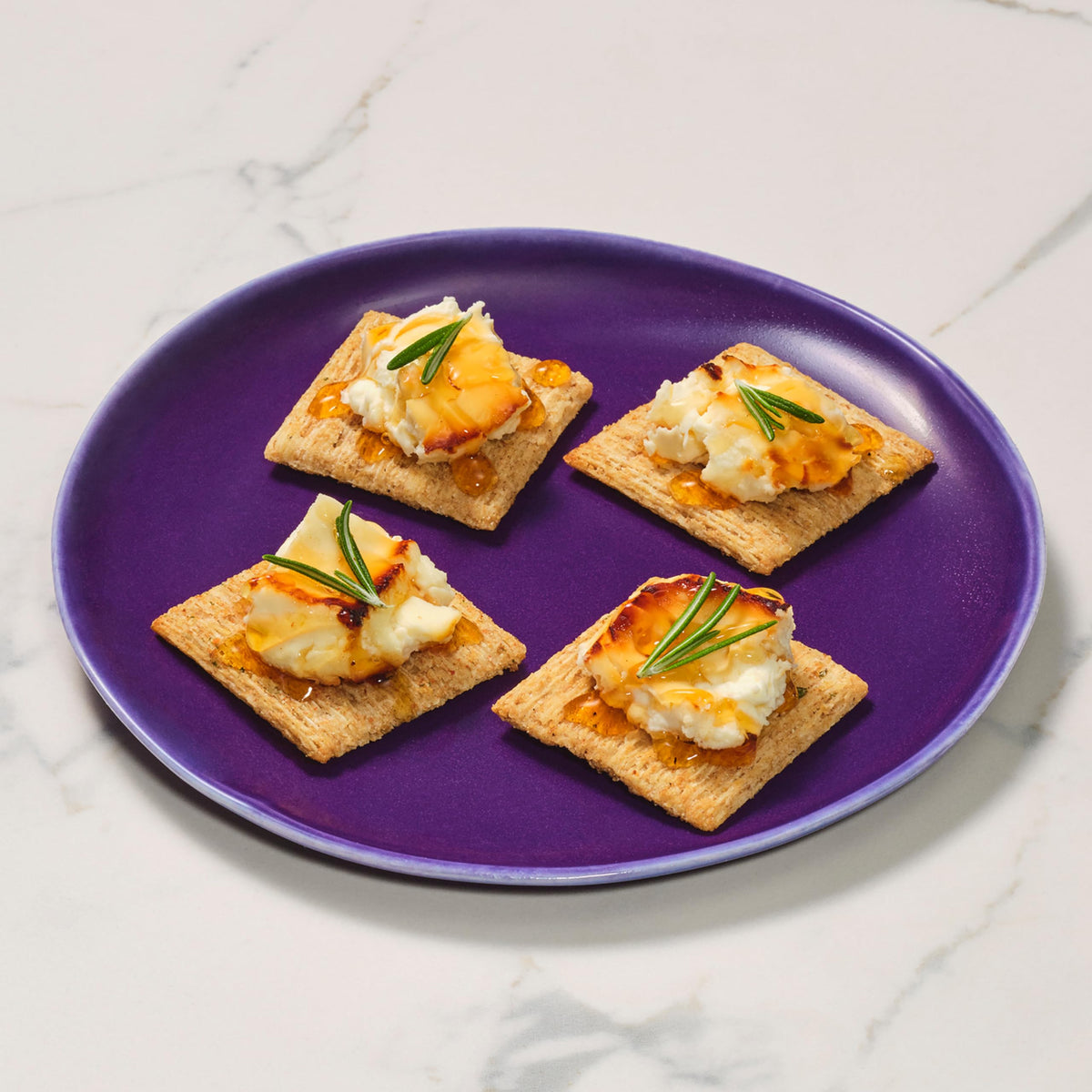 Triscuit rosemary and olive oil crackers on breakroom tray for quick bites