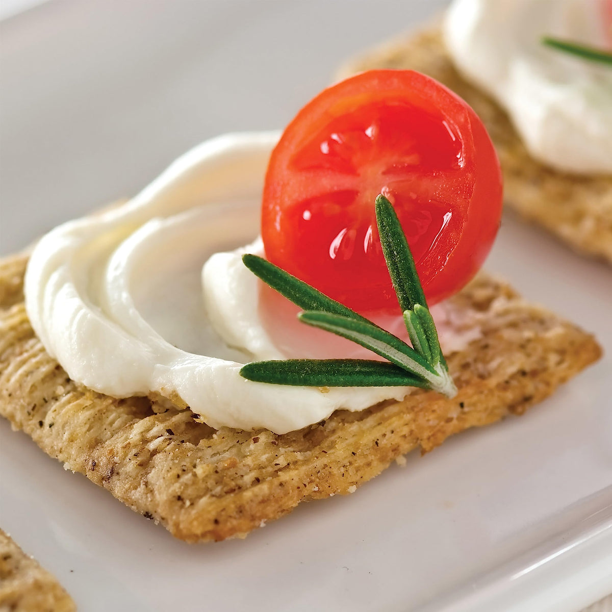 Triscuit Cracked Pepper & Olive Oil crackers ingredient list shows whole grain base.