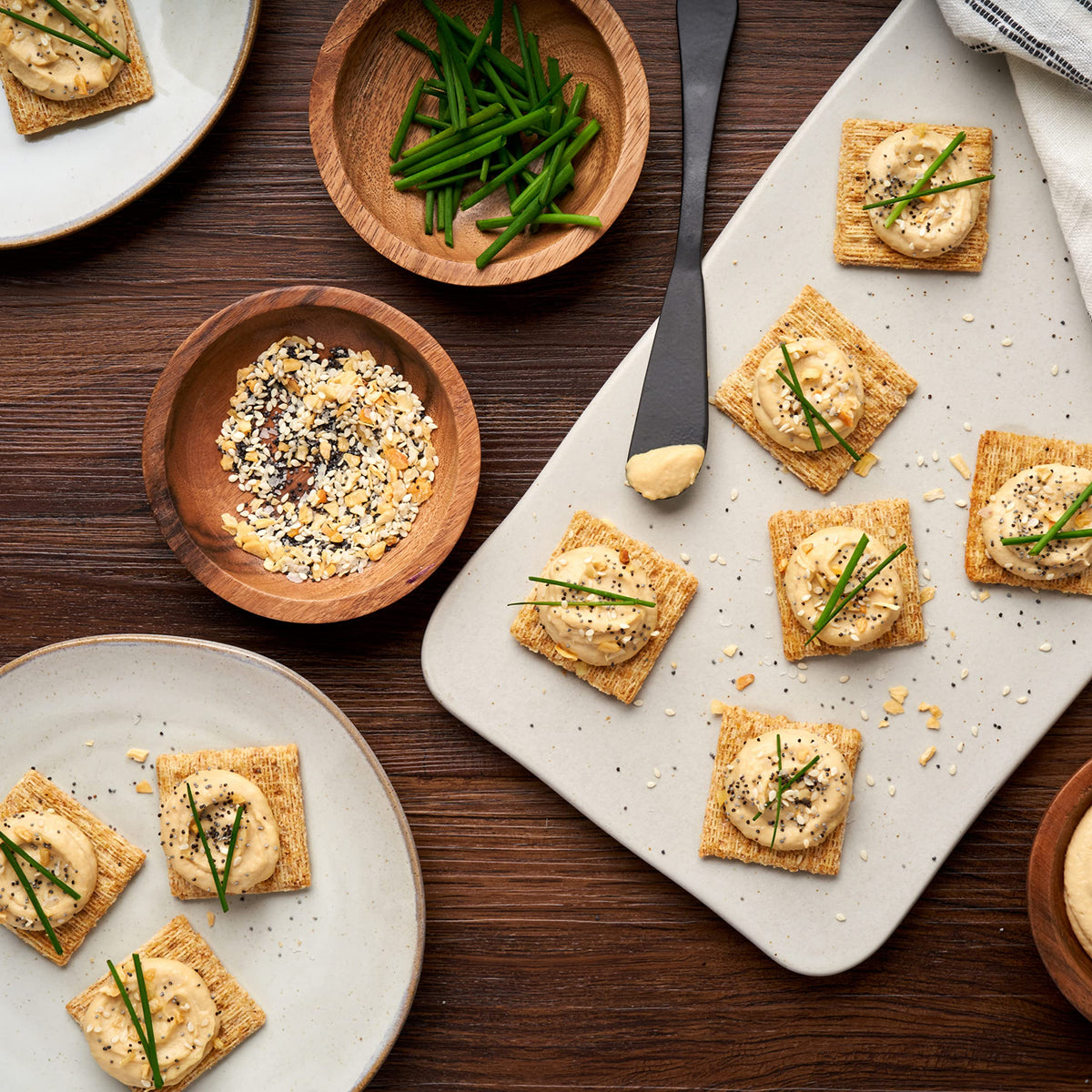 Triscuit Cracked Pepper & Olive Oil crackers stacked in bulk packaging.