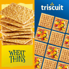 Triscuit crackers displayed on a charcuterie board with toppings.