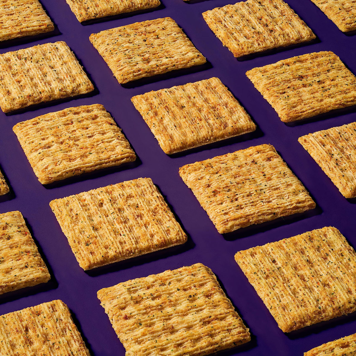Triscuit Garden Herb crackers on a cheese board, perfect with toppings.