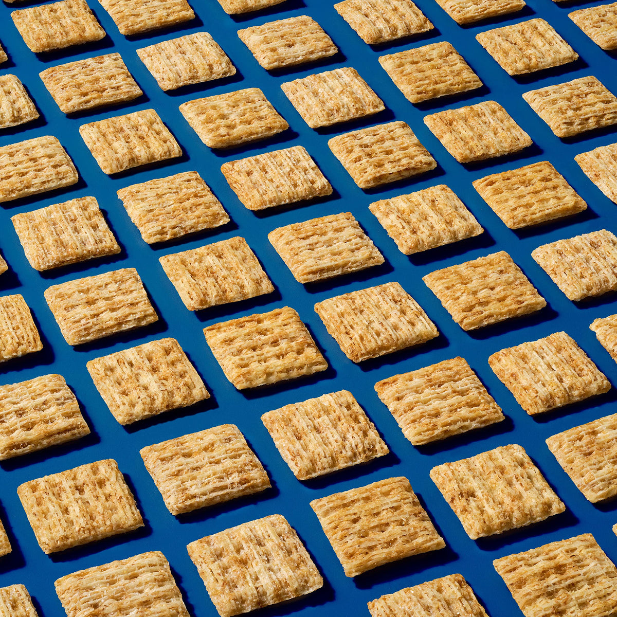 Triscuit Minis Original bite-sized crackers suited for lunchboxes and party trays.