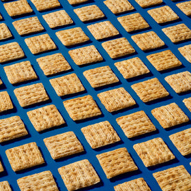 Triscuit Minis Original bite-sized crackers suited for lunchboxes and party trays.