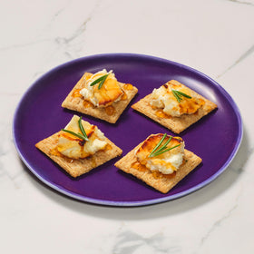 Baked, woven texture of Triscuit Rosemary & Olive Oil crackers