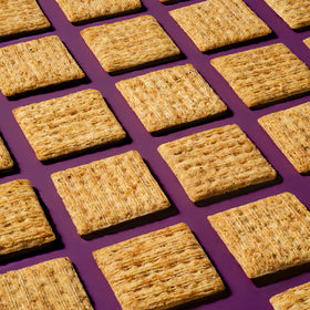 Crackers showing the crunchy woven texture of Triscuit Rosemary & Olive Oil