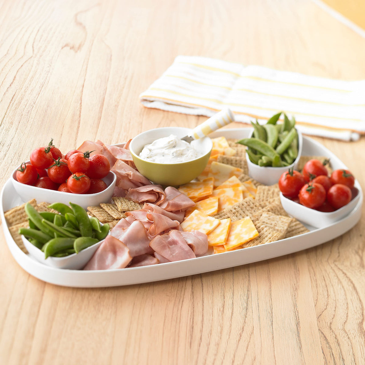 Warm kitchen scene featuring Triscuit Smoked Gouda crackers