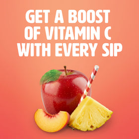 Pour stream of Tropicana Pineapple Peach Mango juice over a glass