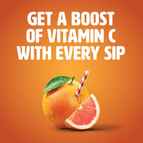 Tropicana Ruby Red Grapefruit juice pouring into glass for refreshing sip.