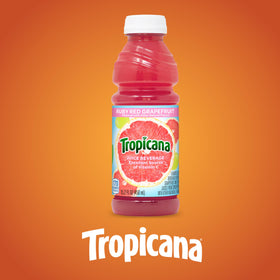 Tropicana Ruby Red grapefruit slice beside juice hinting fresh flavor