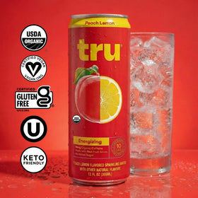 Tru Organic Energy peach lemon can close-up highlighting real fruit juice