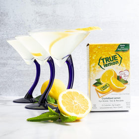 True Lemon crystallized lemon with a glass of water illustrating zero-calorie zest.