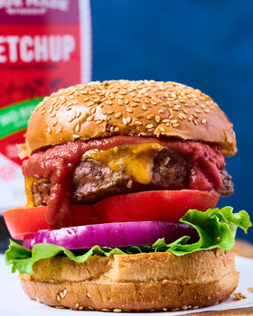 Family at the table enjoying a healthier condiment choice with True Made Foods ketchup.