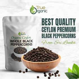 True Organic peppercorns beside grinder, perfect for refills